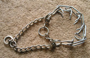 Prong collar; the looped chain limits how tightly the collar can pull in the same way that a Martingale functions.